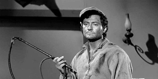 Paul Richards as John Murdock, leader of the black legs, wielding his whip in The Black Whip (1956)