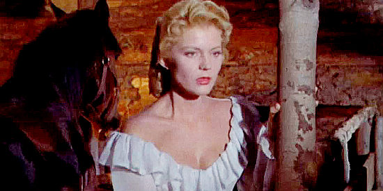 Peggie Castle as Maylene Mason, concerned as Quincannon fights one of the officers in Quincannon, Frontier Scout (1956)