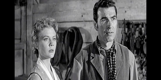 Peggie Castle as Paula Collins and Stephen McNally as Vic Rodell, old flames reunited in Hell's Crossroads (1957)