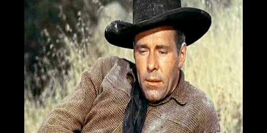 Philip Carey as Brady Sutton, accused of setting up a bank robbery and wondering if his relationship with Nancy is over in Wyoming Renegades (1955)