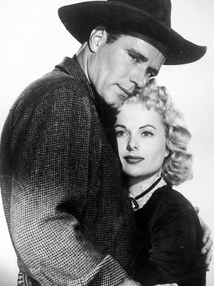 Philip Carey as Brady Sutton and Martha Hyer as Nancy Warren in Wyoming Renegades (1955)
