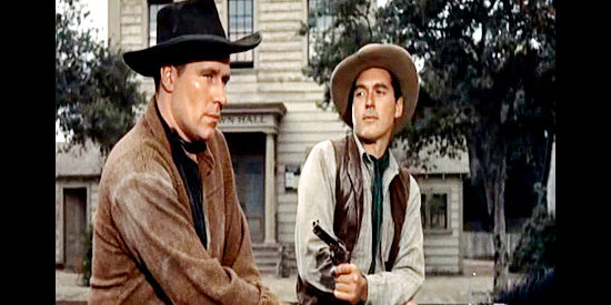 Philip Carey as Brady Sutton, under the gun of Sundance (William Bishop) as the gang makes another stab at the loot in Wyoming Renegades (1955)