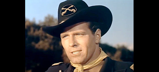 Philip Carey as Capt. Peter Blake, fostering a hatred for army doctors and a love for Laurie MacKaye in They Rode West (1954)