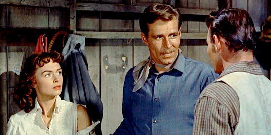 Philip Carey as Frank Slayton (center) in a disagreement with Jess Burgess (Leo Gordon) over Jennifer Ballard (Donna Reed) in Guy Fury (1953)