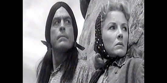 Phyllis Coates as Bess and Rock Shahan as her Indian guide Taslatch on the watch for trouble in Blood Arrow (1958)