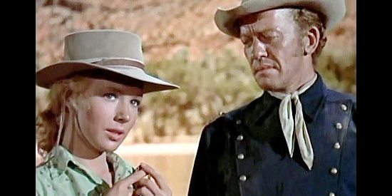 Piper Laurie as Laura Evans, showing off a gift from a friend to Capt. Harper (William Talman) in Smoke Signal (1955)