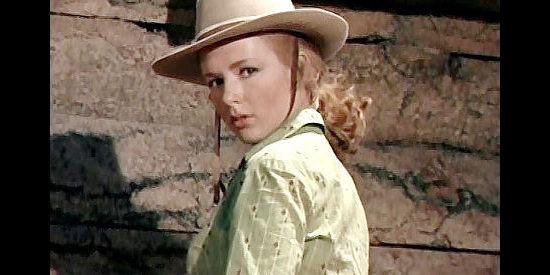 Piper Laurie as Laura Evans, wondering how Brett Halliday, once a respected officer, earned a date with a firing squad in Smoke Signal (1955)