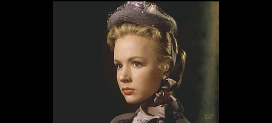 Piper Laurie as Rannah Hayes, listening to a job offer from Dick Braden in Dawn at Socorro (1954)