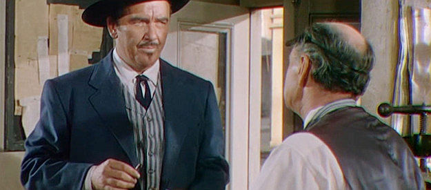 Preston Foster as Kurt Durling, intimidating a newspaper owner in Law and Order (1953)