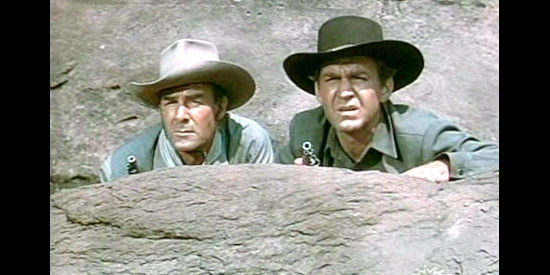 Randolph Scott as Andrew Barclay and Forrest Tucker as Tom Tanner, watching for Galt and his men in The Nevadan (1950)