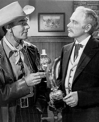Randolph Scott as Andrew Barclay and George Macready as Edward Galt in The Nevadan (1950)