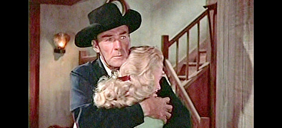Randolph Scott as Capt. John Hayes comforts Jeanie Miller in Westbound (1959)