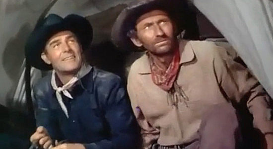 Randolph Scott as Jackson 'Sugarfoot' Reden and sidekick 'Fly Up the Creek' Jones (Arthur Hunnicutt) reacting to the sound of gunfire in Sugarfoot (1951)