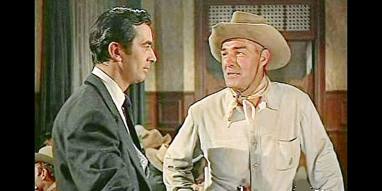 Randolph Scott as Larry Madden, returning after five years to avenge a wrong by Tuck Ordway in Tall Man Riding ((1955)