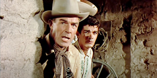 Randolph Scott as Tom Buchanan and Manuel Rojas as Juan de la Vega, ready for a showdown in Buchanan Rides Alone (1958)