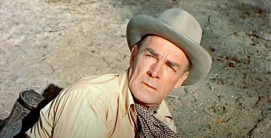 Randolph Scott as Tom Buchanan, opening his eyes to a surprise in Buchanan Rides Alone (1958)