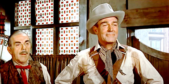 Randolph Scott as Tom Buchanan, witnessing the lover's spat that starts the trouble in Buchanan Rides Alone (1958)