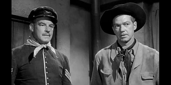 Ray Teal as Sergeant 'Rock' O'Rorke and Bill Williams as James Kingston, requesting help from the cavalry in Apache Ambush (1955)