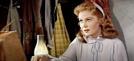 Rhonda Fleming as Cheyenne O'Mally, trying to figure out how to deal with a husband who didn't disappear as promised in Bullwhip (1958)