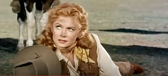 Rhonda Fleming as Cheyenne O'Mally, yanked from her horse by her own bullwhip in Bullwhip (1958)