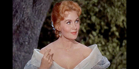 Rhonda Fleming as Cora Lee Collins, Jesse James' main squeeze and beneficiary of his life insurance policy in Alias Jesse James (1959)