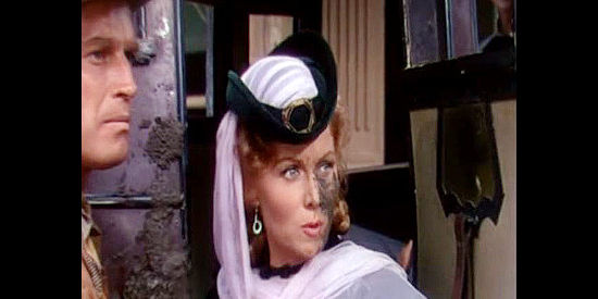 Rhonda Fleming as Evelyn Hastings, reacting to the mud pie she finds herself wearing in Pony Express (1953)