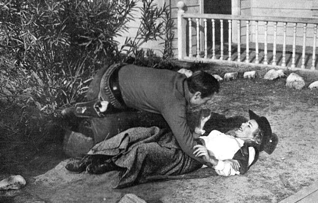 Richard Denning as Steve Ward tackles old friend Susan Grant (Cathy Downs) to keep her from shooting him in The Oklahoma Woman (1956)