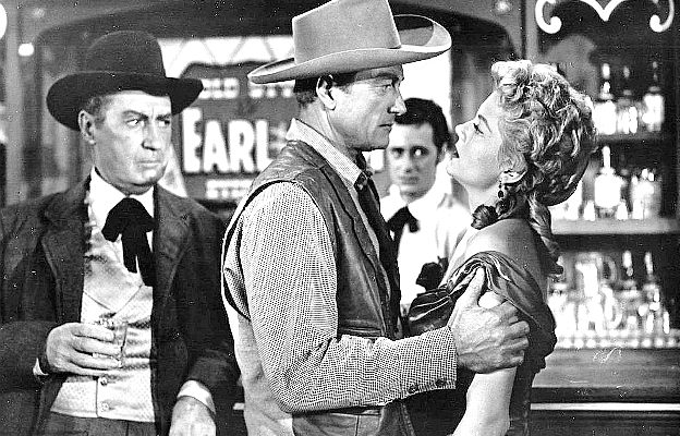 Richard Denning as Steve Ward tries to get straight answers from Marie 'Oklahoma' Saunders in The Oklahoma Woman (1956)