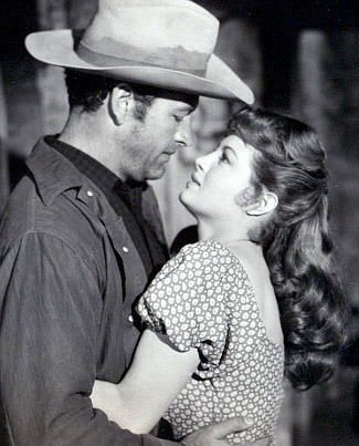 Richard Egan as Wes Tancred and Angie Dickinson as Cathy in Tension at Table Rock (1956)