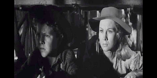 Richard Eyler as Chad Gray and Virginia Mayo as his mom Celia, trying to slip away from a ranch surrounded by Indians in Fort Dobbs (1958)