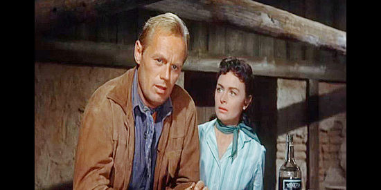 Richard Widmark as Jim Slater and Donna Reed as Karyl Orton, after finding Bonniwell in Backlash (1956)