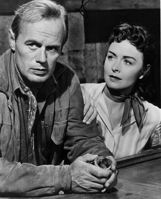 Richard Widmark as Jim Slater and Donna Reed as Karyl Orton in Backlash (1956)