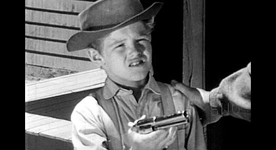 Ricky Sorenson as Jeff, a young boy returning Cheney's gun after he learns the outlaw has committed murder in A Lust to Kill (1958)