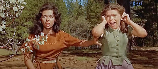 Rita Moreno as Hetty and Cathy O'Donnell as Judith, spotting their father on a stake surrounded by fire in The Deerslayer (1957)