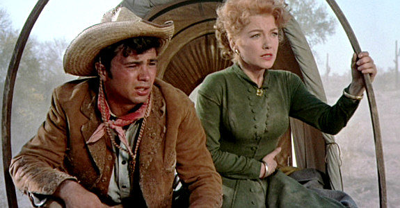 Robert Blake as Rafael Ortega, order to take Lorna Saunders (Anne Baxter) back to the Bar S ranch in Three Violent People (1957)