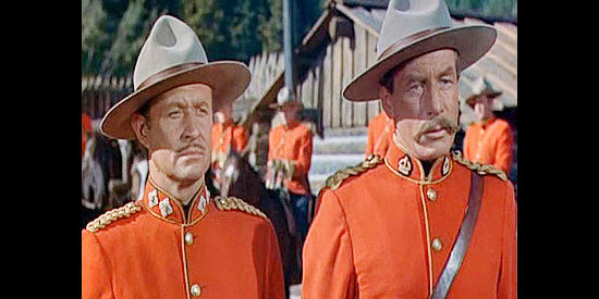 Robert Douglas as Benton and Lowell Gilmore as Banks, the Mountie officers determine to drive the Sioux out of Canada in Saskatchewan (1954)