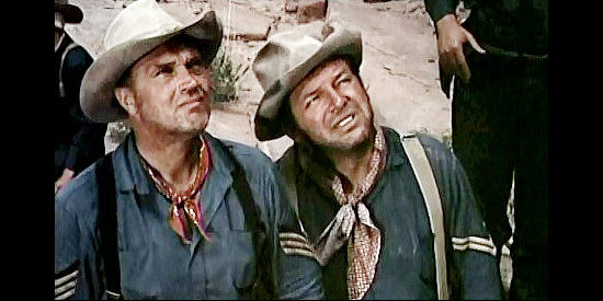 Robert J. WIlke as Sgt. Daly and Gordon Jones as Cpl. Rogers, watching a colleague climb a cliff in hopes of fetching reinforcements in Smoke Signal (1955)