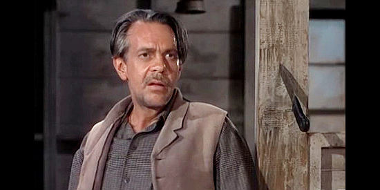 Robert Massey as Boss Kruger, reacting to a knife meant for his back in Barricade (1950)