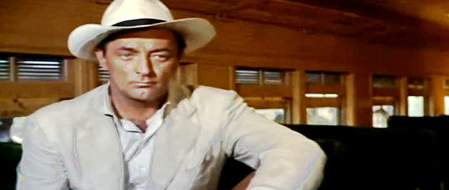 Robert Mitchum as Wilson, trying to cash in on someone else's cache of weapons during a Mexican revolution in Bandido! (1956)