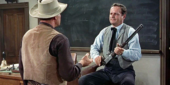 Robert Osterloh as Rigdon, the school teacher who tries to rile the farmers into a lynch mob frenzy in Star in the Dust (1956)