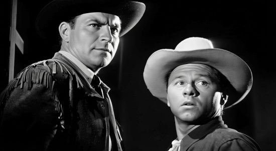 Robert Preston as Texas Ranger Joe Waldner and Mickey Rooney as J. Dennis O'Moore discuss their next move in My Outlaw Brother (1951)