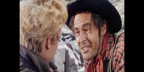 Robert Ryan as Ben Vandergoat, sensing a chance to escape and sharing his excitement with Lina in The Naked Spur (1953)
