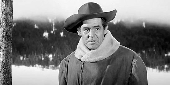 Robert Ryan as Blaise Starrett, the cattleman who becomes protector of a small Wyoming town in Da of the Outlaw (1959)