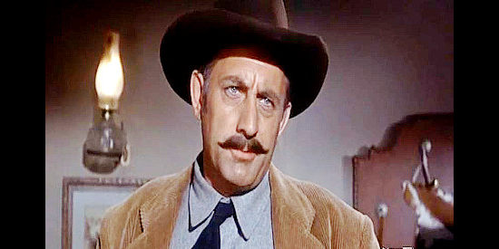 Robert Simon as Marshal Collins, investigating the mysterious death of a stage passenger in The Black Dakotas (1954)