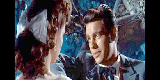 Robert Wagner as Ben Devereaux, turning on the Devereaux charm for Barbara, a governor's daughter in Broken Lance (1954)