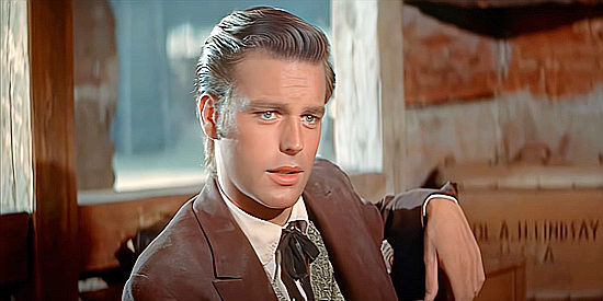 Robert Wagner as Josh Tanner, announcing his presence and his lack of concern about Indians in White Feather (1955)