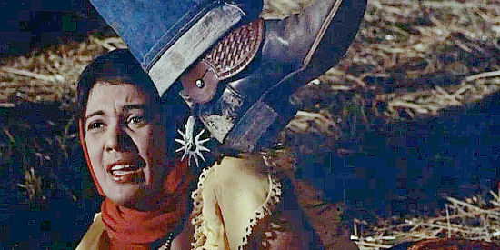 Roberta Haynes as Estella Morales, threatened with a spur in Gun Fury (1953)