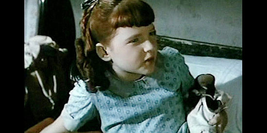 Robin Fletcher as Nancy Dempster, the captain's young daugther in Slaughter Trail (1951)