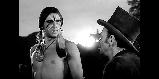 Rock Hudson as Young Bull, an Indian chief negotiating with Joe Lamont (John McIntire) in Winchester '73 (1950)