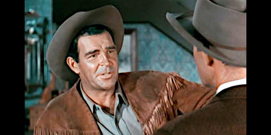 Rod Cameron as Tom Clay, telling Travers about the less-than-utopian reality facing women and children in frontier California in Fort Osage (1952)